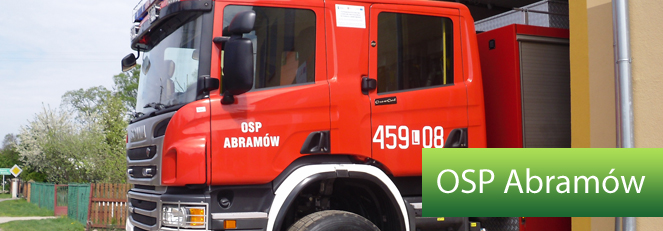 Wóz strażacki i napis OSP Abramów