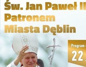 Fragment plakatu promującego wydarzenie, napis: "Św, Jan Paweł II Patronem Miasta Dęblin", pod napisem zdjęcie Papieża Jana Pawła II