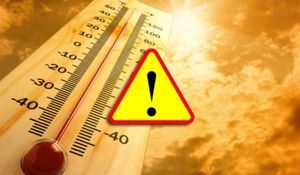 termometr wskazujący wysoką temperaturę oraz znak ostrzeżenia
