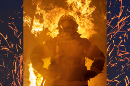 Grafika przedstawia strażaka w ogniu
