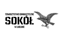 Logo Towarzystwa Gimnastycznego "Sokół" w Lublinie przedstawiające czarny obrys orła w locie z rozłożonymi skrzydłami, nad którym znajduje się nazwa organizacji.
