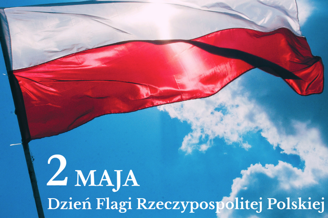 Flaga Polski powiewa na tle jasnego, słonecznego nieba z chmurami. W lewym dolnym rogu napis "2 maja Dzień Flagi Rzeczypospolitej Polskiej". W lewym górnym rogu logo Powiatu Lubelskiego.