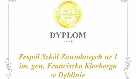 Zdjęcie dyplomu z złotymi zdobieniami, zawierającego tekst