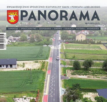Okładka magazynu przedstawiająca drogę biegnącą przez zielone pola i kilka domów. Na dole okładki znajduje się napis o otwarciu nowego ciągu komunikacyjnego.