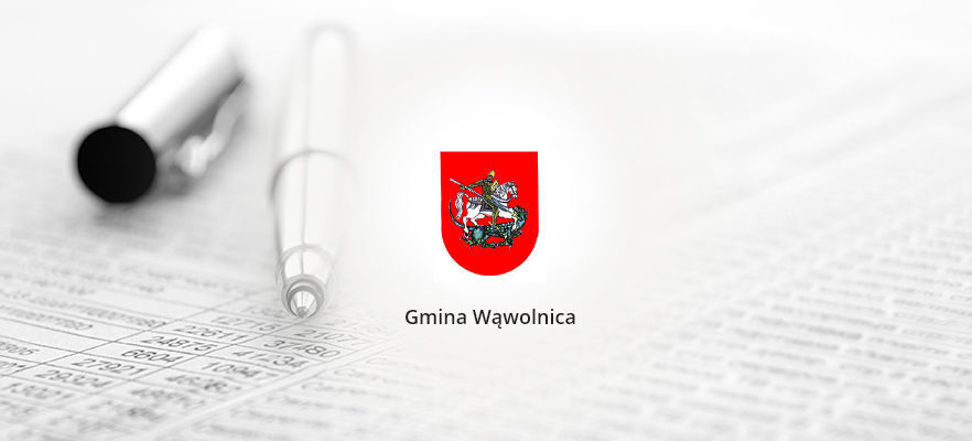 Herb gminy Wąwolnica na tle dokumentu.