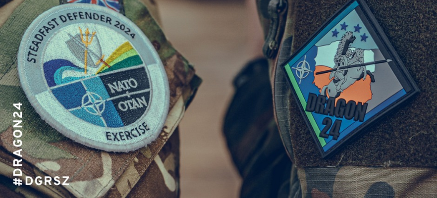 Zdjęcie naszywek na mundurze wojskowym, jedna z logo NATO i napisem "Exercise", druga z rysunkiem smoka i napisem "DRAGON 24". #DRAGON24 #DGRSZ
