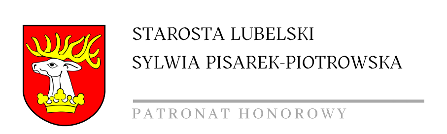 Herb z białym koźlęciem na czerwonym tle, nad napisem "STAROSTA LUBELSKI SYLWIA PISAREK-PIOTROWSKA, PATRONAT HONOROWY".