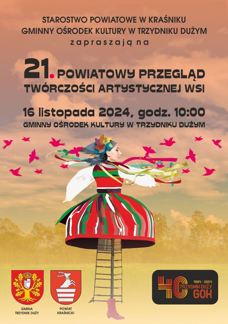 Plakat wydarzenia kulturalnego z ilustracją tańczącej kobiety w tradycyjnym, kolorowym stroju ludowym, otoczonej przez motyle. Zawiera tekst informacyjny i herby.