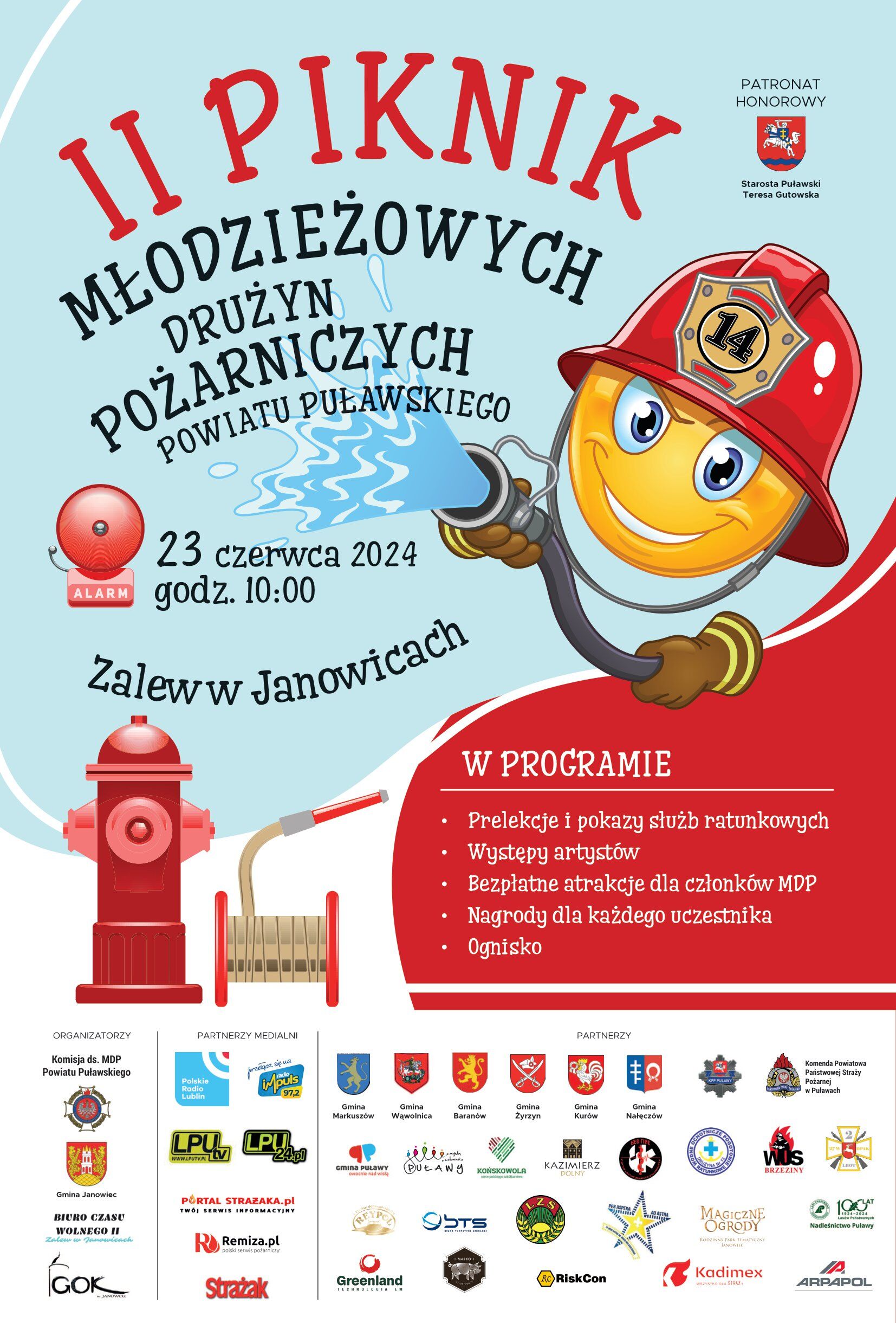 Plakat zapraszający na "II Piknik Młodzieżowych Ochotniczych Straży Pożarnych" z ilustracją roześmianego strażaka-kreskówki, informacjami o wydarzeniu, i logotypami sponsorów.